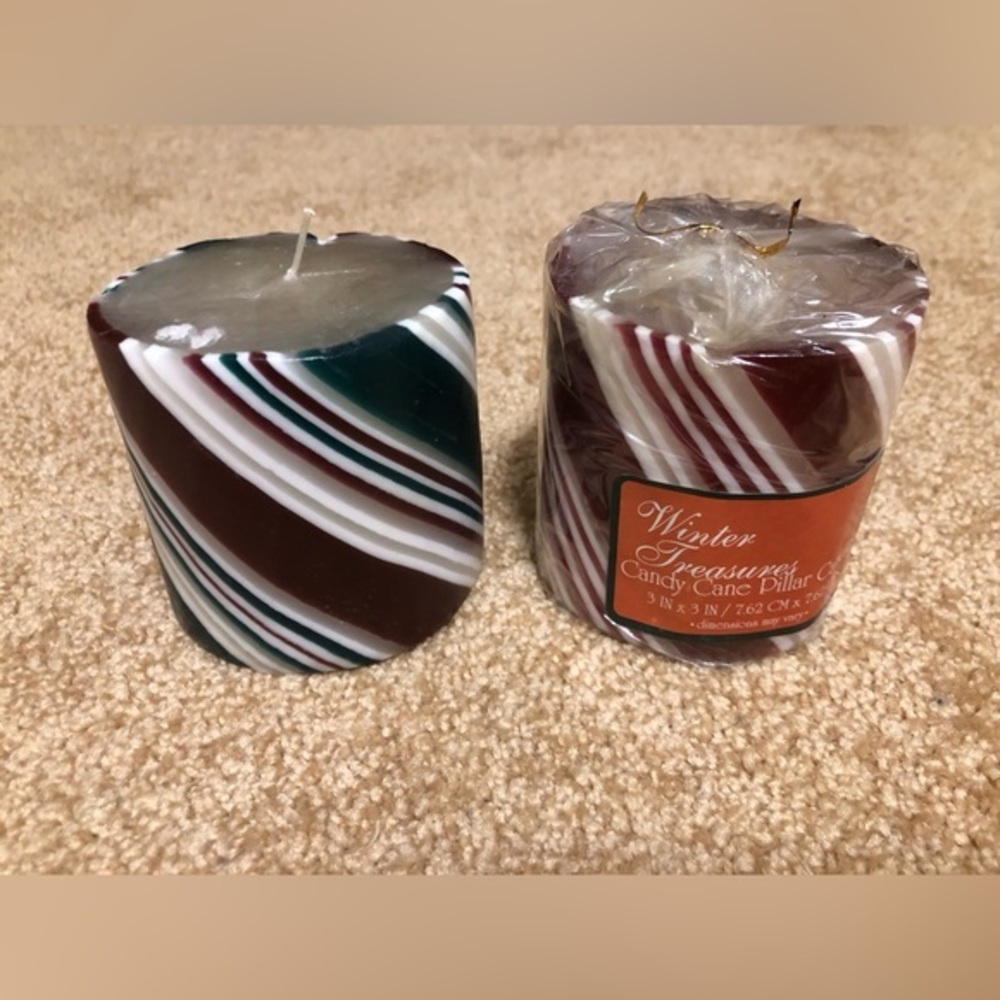 Two holiday striped candles